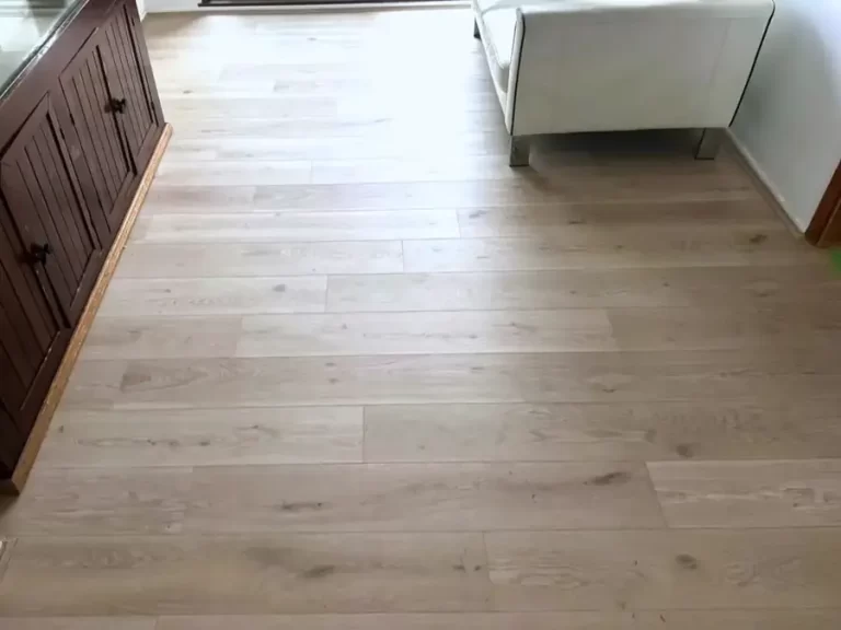 Light oak timber-look laminate flooring installed in a Sydney open-plan living room