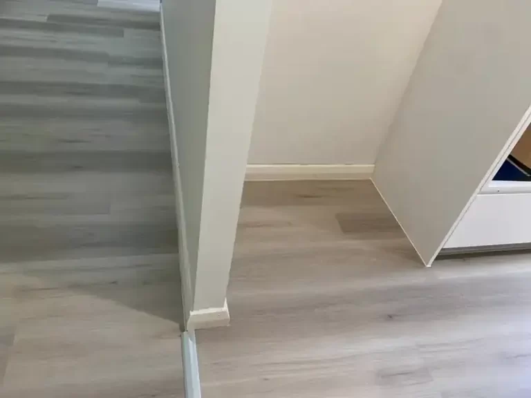 Timber-look plank flooring in the corner of a Sydney bedroom