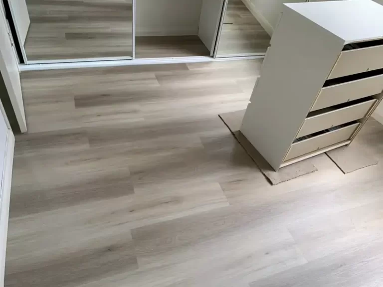Light oak-look vinyl plank flooring in a Sydney dressing room