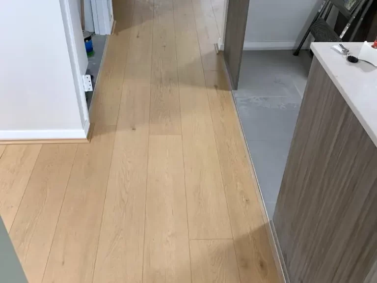 Natural oak-look laminate flooring running through an entry hall in a Sydney home