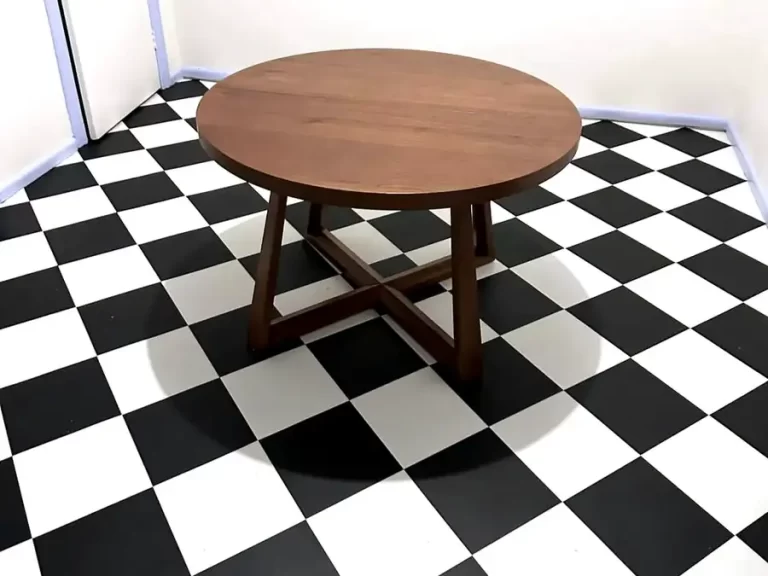 Black and white checkerboard vinyl tile flooring installed in a Sydney kitchen and dining area